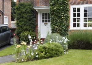 Semi detatched house in the suburbs with a neat and tidy front garden in the spring