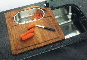 over the sink cutting board with chopped carrots