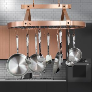saucepans hanging from the ceiling in a kitchen
